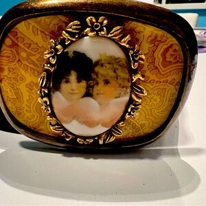 Allison Daniel’s Cherub belt buckle “Fiorucci style”